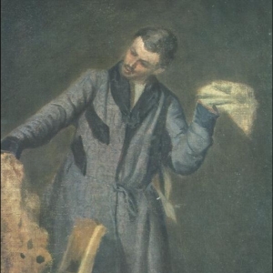 Молодой человек, играющий с собакой